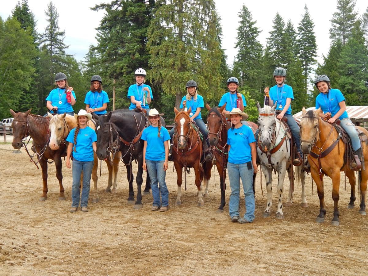 kids on horses lined up in an arena at Western Pleasure Guest Ranch Youth Horsemanship program